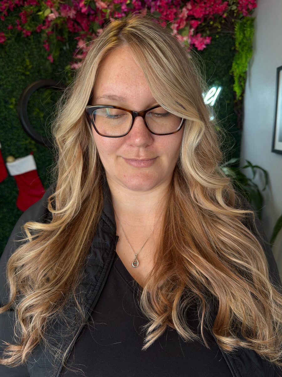 Long strawberry blonde hair with waves